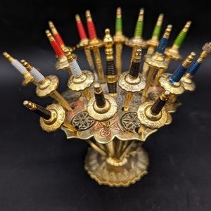 A Toledo Spain Large Stand of 18 Sword of Cocktail sticks